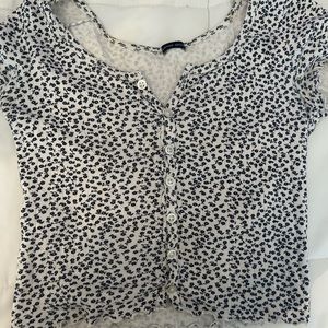 Brandy Melville Zella Top with navy flowers on it,barley worn,in great condition